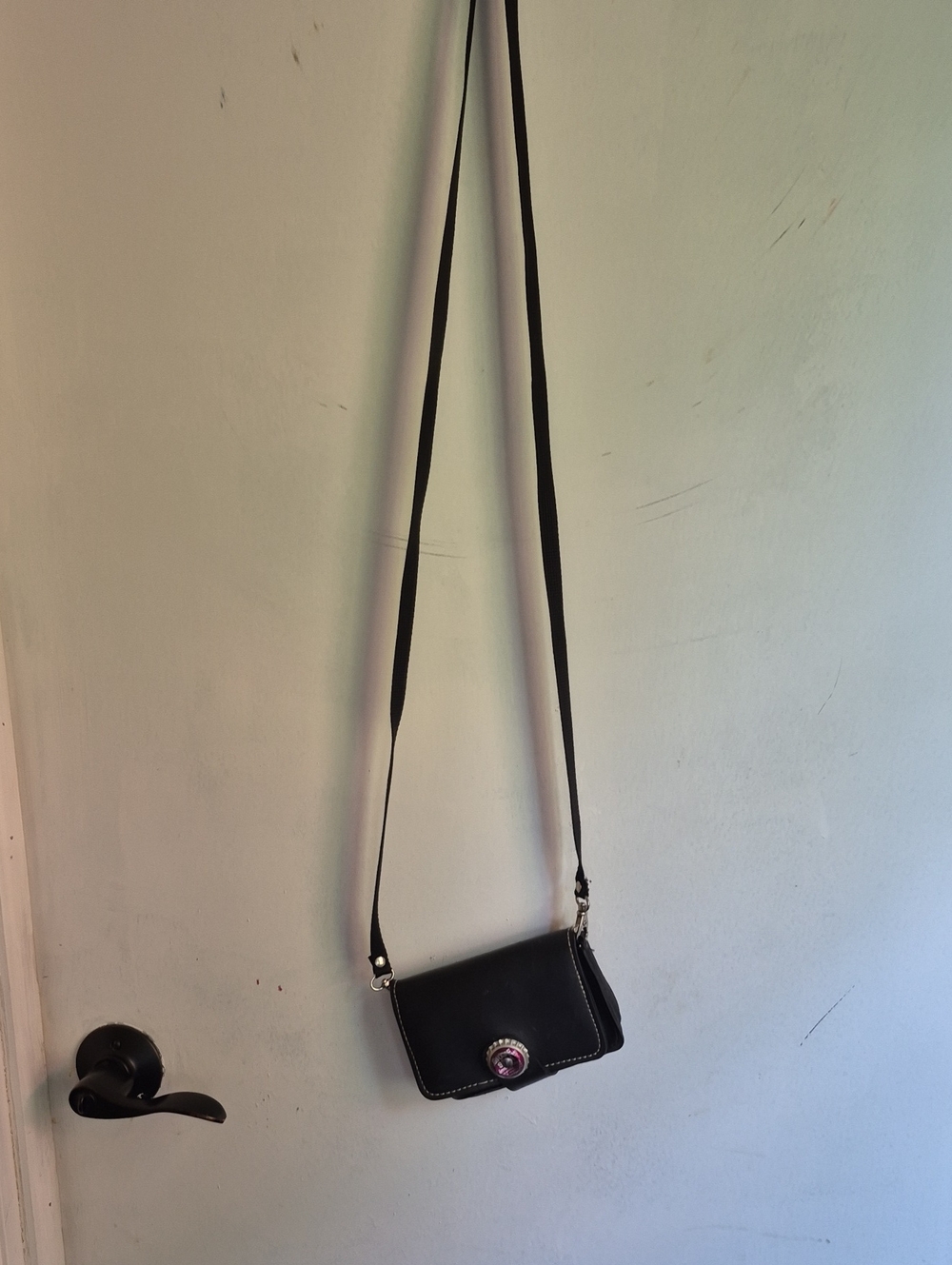 Classic Black Crossbody Bag with Decorative Accent
